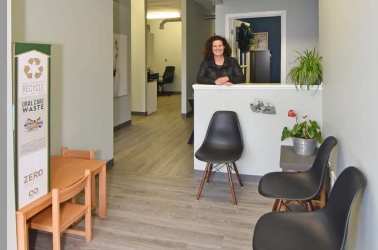 Whitney Sanders greeting visitors in waiting room